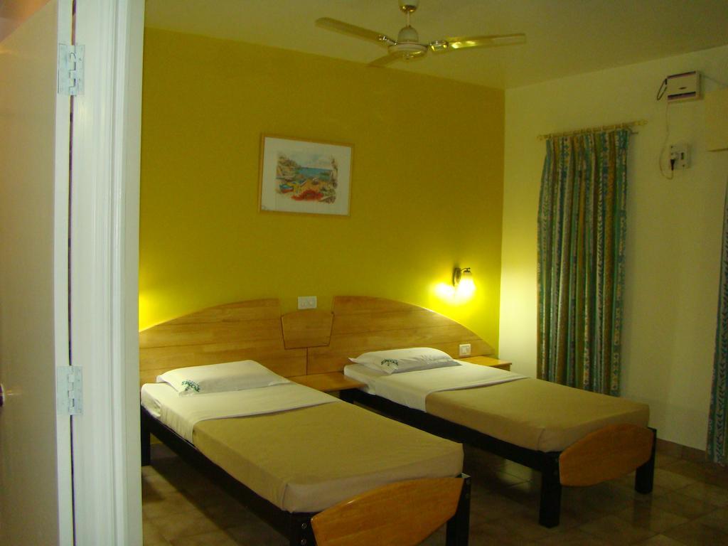 Tom'S Hotel Bangalore Habitación foto